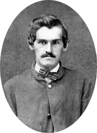 Black and white photo of Corporal William F. Hudleson of Company A, 80th Indiana Volunteer Infantry, in uniform, enhanced image.