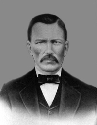 Post-war black and white photograph of James Patrick Doyle in a civilian suit
