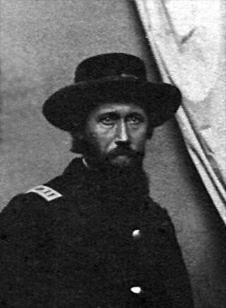 Black and white post-war photo of Captain Isum Gwin of Company D, 80th Indiana Volunteer Infantry, in uniform, enhanced image.