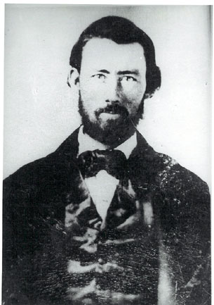 Black and white photograph taken circa 1858 of Daniel McDonald  wearing a handsome civilian suit 