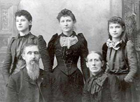 Black and white photograph taken after the Civil War of Recruit William P. Males of Company B in civilian clothes with his family