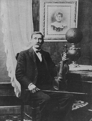 Black and white photgraph of Musician Jesse Bryant of Company H  in civilian clothing, taken well after the Civil War, original image